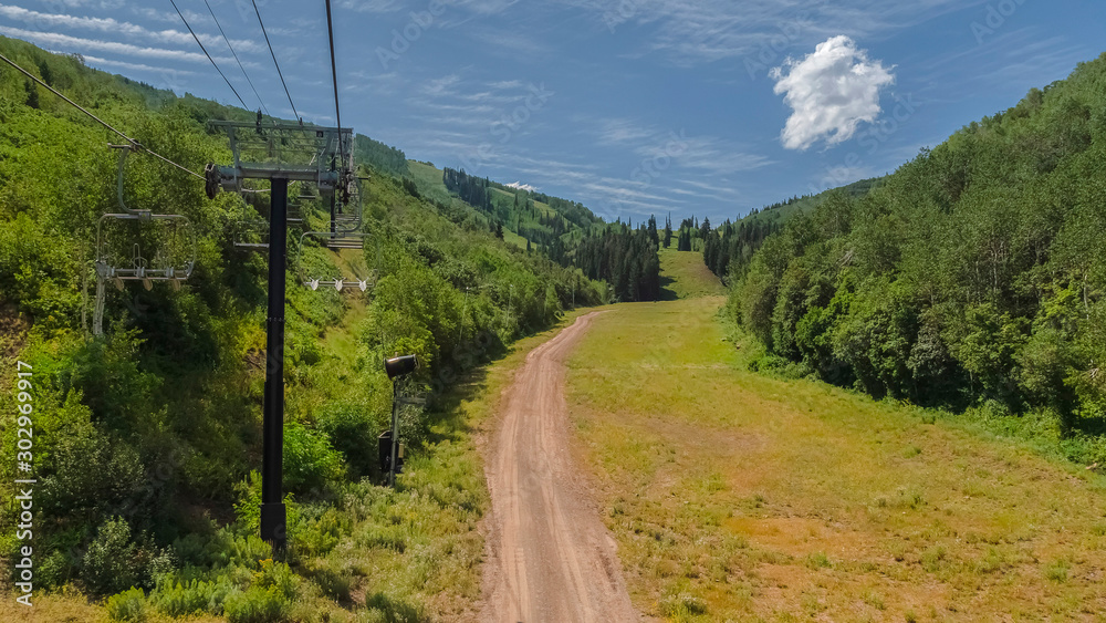 Panorama Hiking trails and chairlifts on a scenic mountain with lush trees at off season