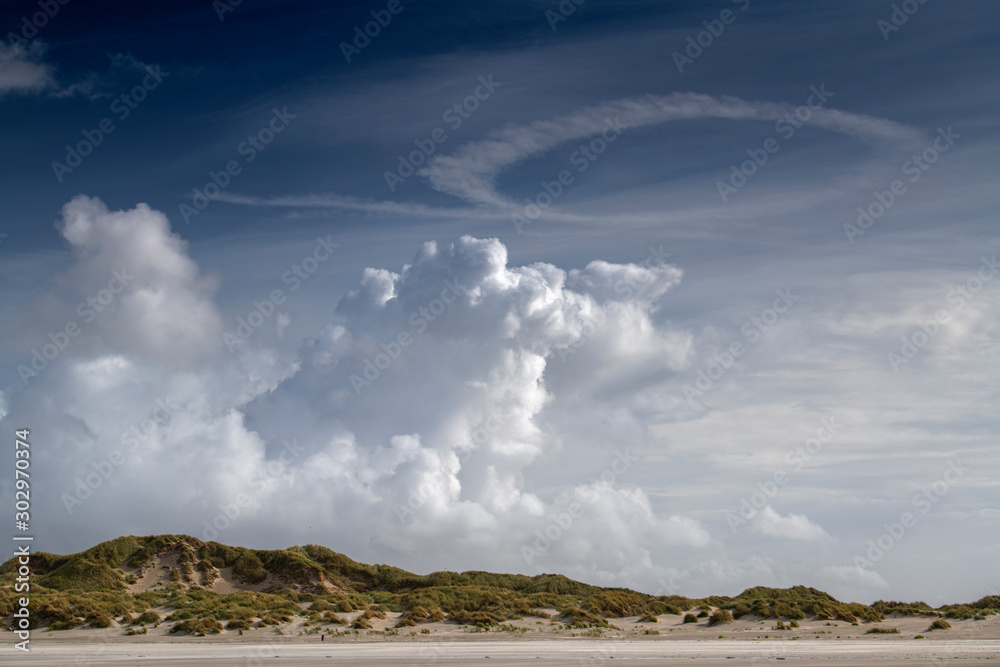 Cloud formations over the dunes on the island of Terschelling .