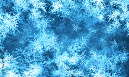 Beautiful textured frozen glass window background with snowflakes photo