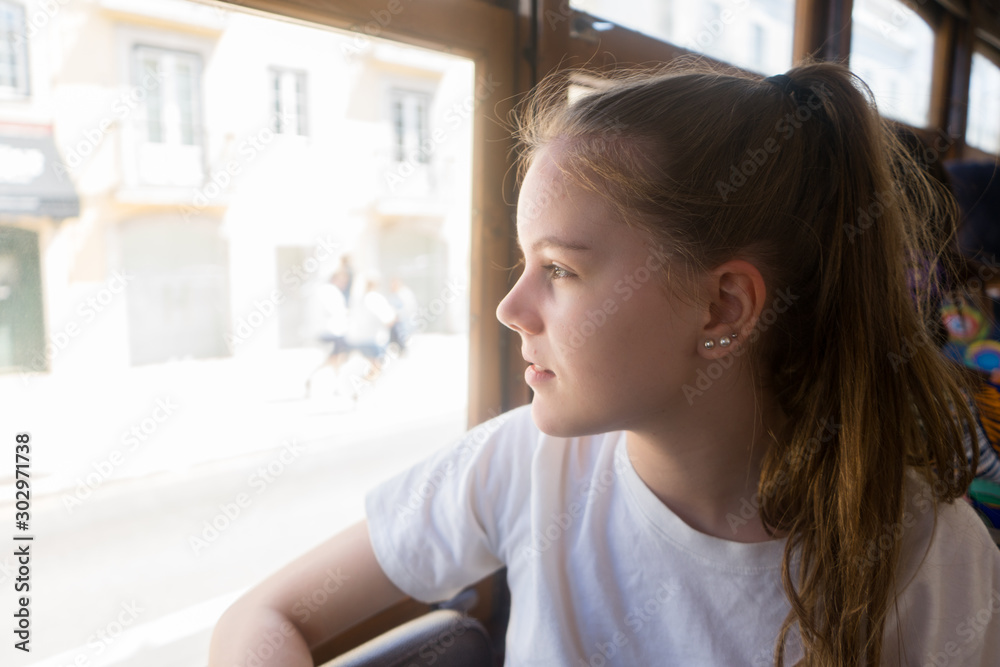 Girl looking out the window