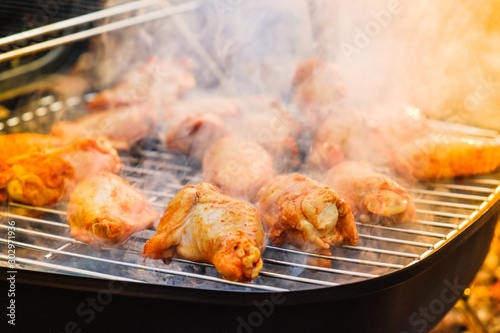 Barbecue chicken wings grilling fire,  coal coals.