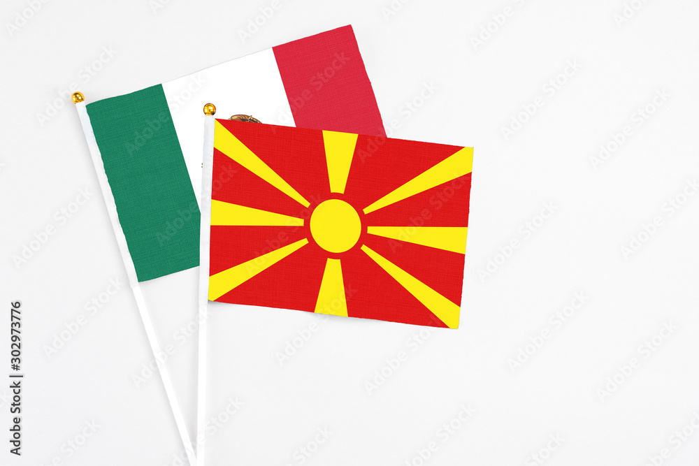 Macedonia and Mexico stick flags on white background. High quality fabric, miniature national flag. Peaceful global concept.White floor for copy space.