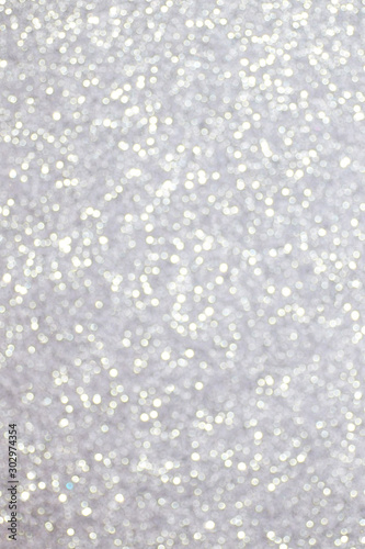 Silver glitter texture background, sparkling Christmas wallpaper.