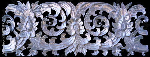 Pattern of Thai silver metal with a pattern of leafs carved on textured background