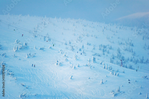 people go skiing at the top of the mountain