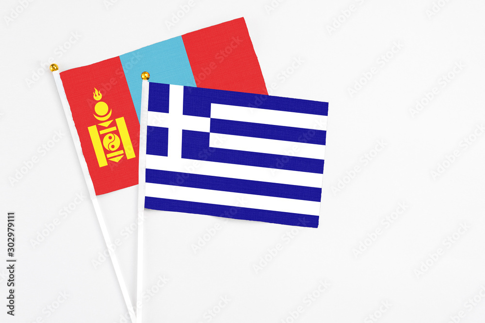 Obraz premium Greece and Mongolia stick flags on white background. High quality fabric, miniature national flag. Peaceful global concept.White floor for copy space.