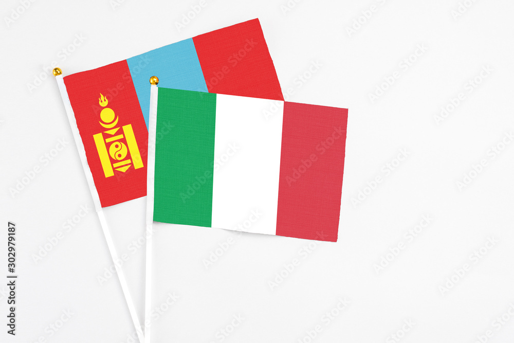 Italy and Mongolia stick flags on white background. High quality fabric, miniature national flag. Peaceful global concept.White floor for copy space. Italy and Mongolia stick flags on white background. High quality fabric, miniature national flag. Peaceful global concept.White floor for copy space.