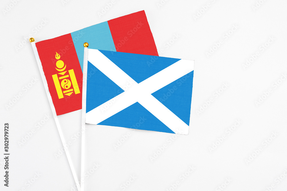 Scotland and Mongolia stick flags on white background. High quality fabric, miniature national flag. Peaceful global concept.White floor for copy space. Scotland and Mongolia stick flags on white background. High quality fabric, miniature national flag. Peaceful global concept.White floor for copy space.