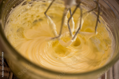 beating butter and eggs. dough preparation process.