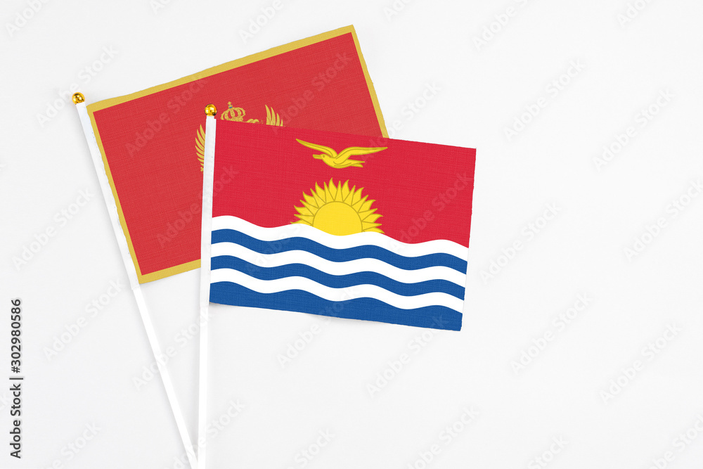 Naklejka premium Kiribati and Montenegro stick flags on white background. High quality fabric, miniature national flag. Peaceful global concept.White floor for copy space.