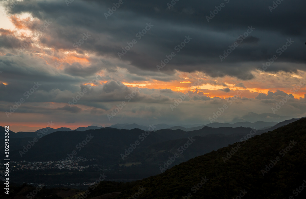 dramatic sunset with storm approching in mountains of dominican republic