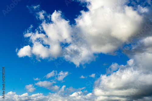 Sky scapes of billowy clouds and blue skies background and wallpaper or sky replacements