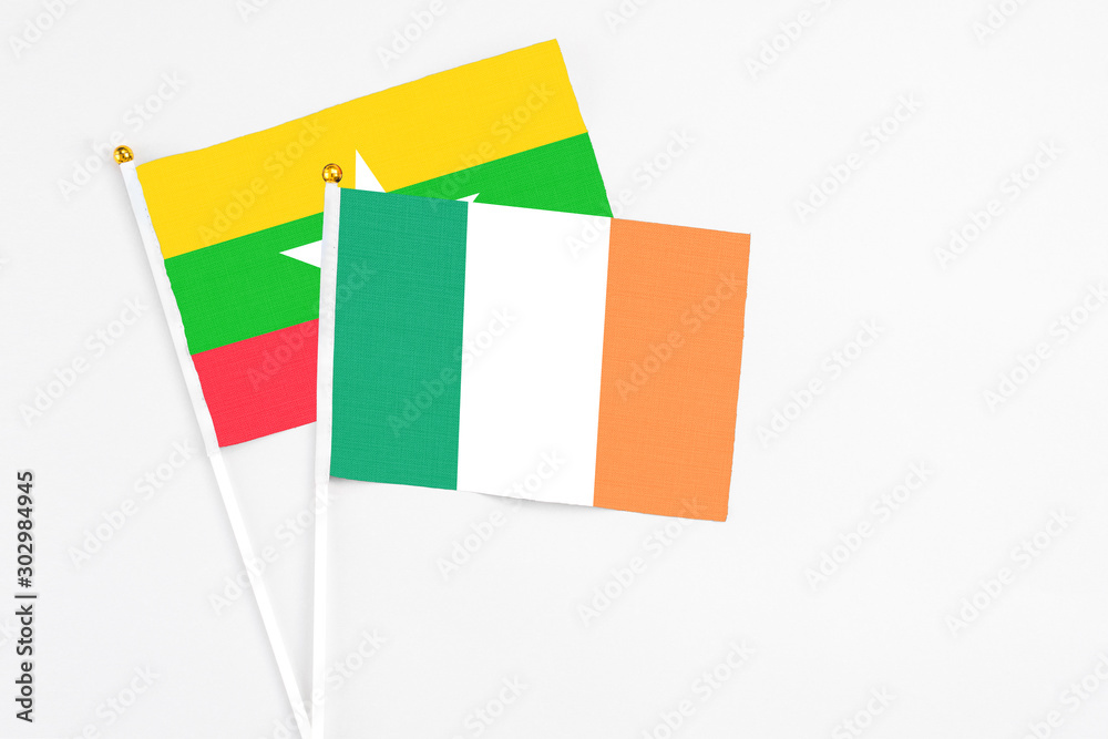 Ireland and Myanmar stick flags on white background. High quality fabric, miniature national flag. Peaceful global concept.White floor for copy space. Ireland and Myanmar stick flags on white background. High quality fabric, miniature national flag. Peaceful global concept.White floor for copy space.