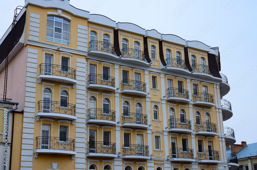 An old restored building in the middle of a regular Poltava street