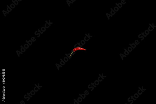 peperoncino rosso piccante su fondo nero photo