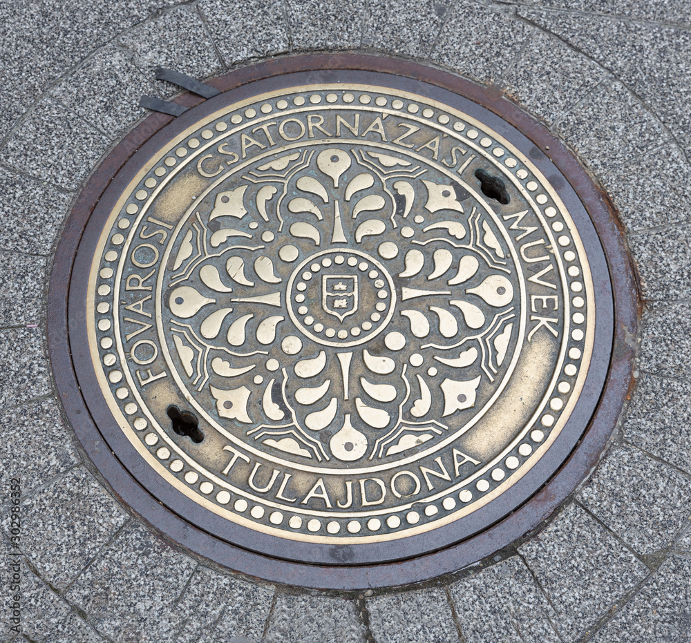Decorated manhole cover downtown in Budapest, capital city Hungary