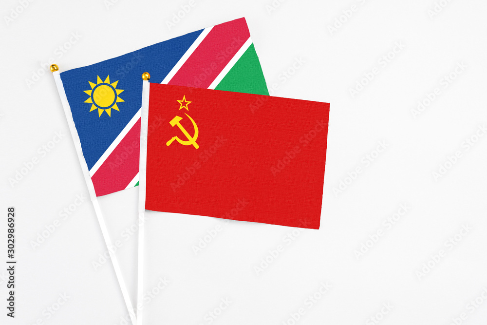 Soviet Union and Namibia stick flags on white background. High quality fabric, miniature national flag. Peaceful global concept.White floor for copy space. Soviet Union and Namibia stick flags on white background. High quality fabric, miniature national flag. Peaceful global concept.White floor for copy space.