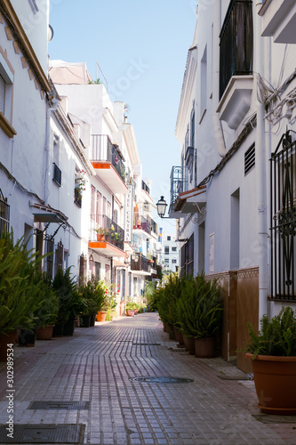 Fototapeta Naklejka Na Ścianę i Meble -  Typical old town street in Marbella, Costa del Sol, Andalusia, Spain, Europe