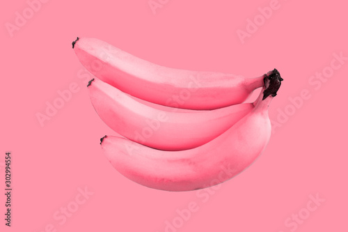 Pink unreal bananas on pink background, crazy concept 