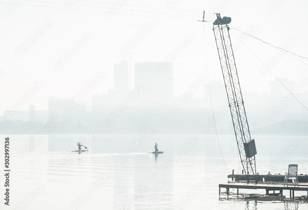 rowers swim at sunrise in the city