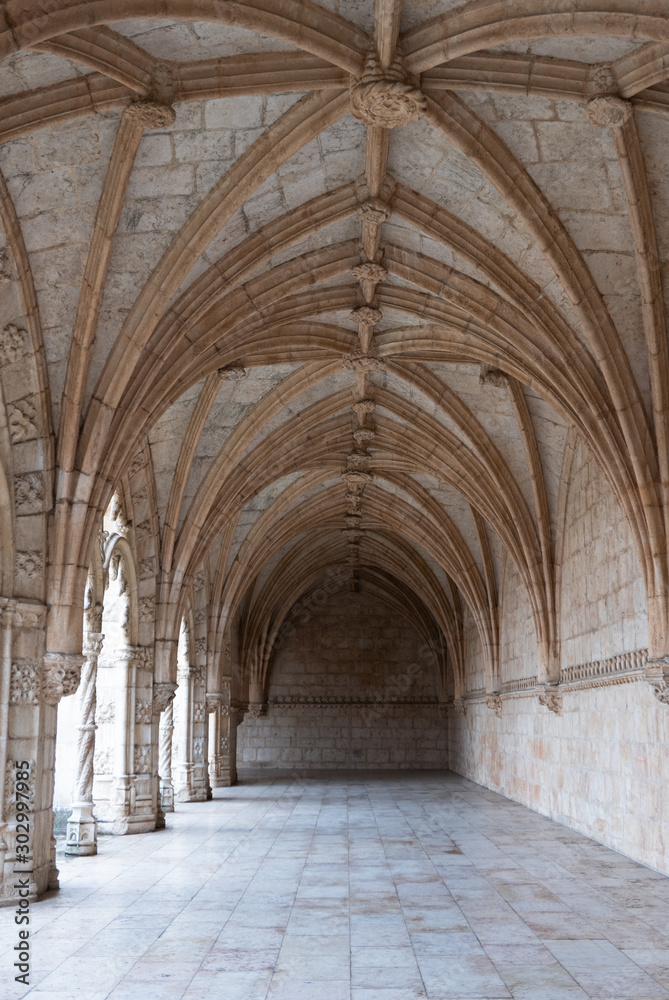 Archways in an old monastery in Portugal, vertical 