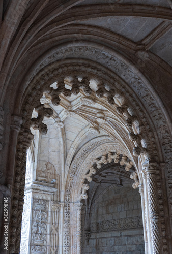 Archways in an old monastery in Portugal,vertical