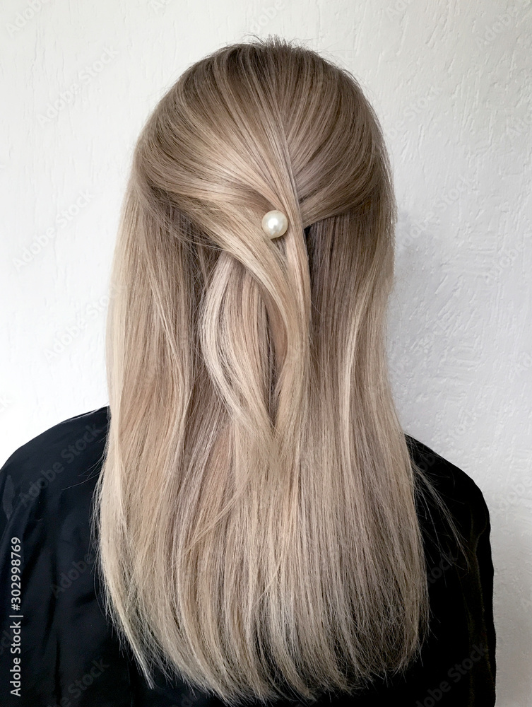 Naklejka premium Long blond hair with balayage 