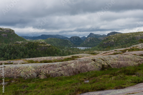 Mountains on the way to the Preachers Pulpit Rock in fjord Lysefjord - Norway - nature and travel background. Lake Tjodnane, july 2019 photo