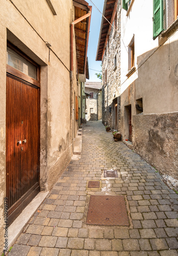 Narrow street of mountain ancient village Zelbio  Italy
