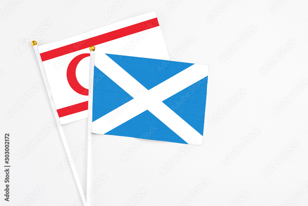 Scotland and Northern Cyprus stick flags on white background. High quality fabric, miniature national flag. Peaceful global concept.White floor for copy space. Scotland and Northern Cyprus stick flags on white background. High quality fabric, miniature national flag. Peaceful global concept.White floor for copy space.