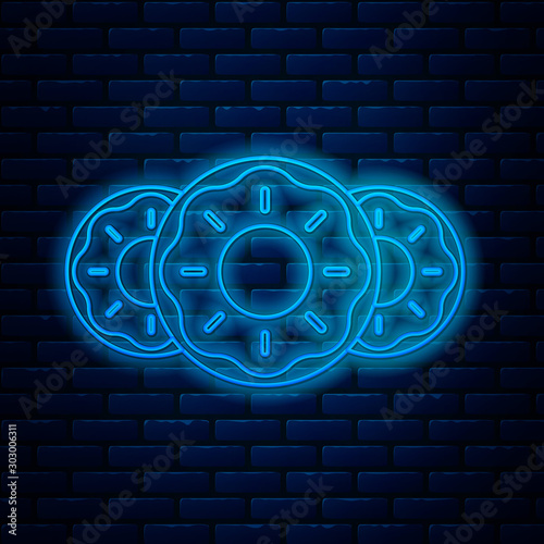 Glowing neon line Donut with sweet glaze icon isolated on brick wall background. Vector Illustration
