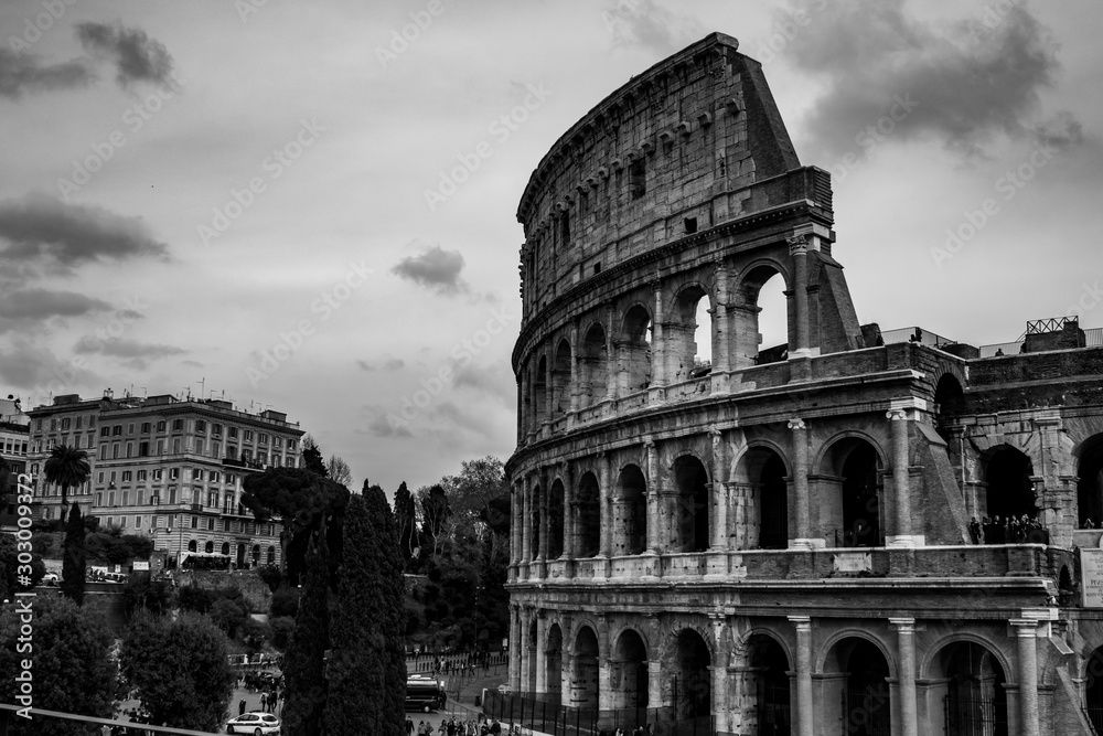 colosseum in rome in black and white with cloud son the background
