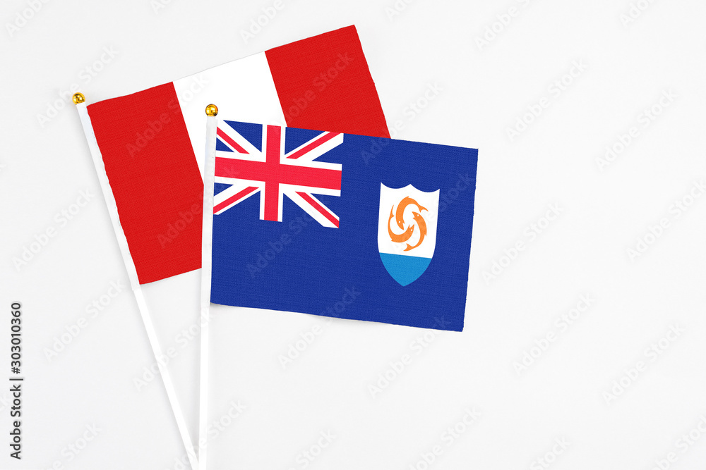 Fototapeta premium Anguilla and Peru stick flags on white background. High quality fabric, miniature national flag. Peaceful global concept.White floor for copy space.