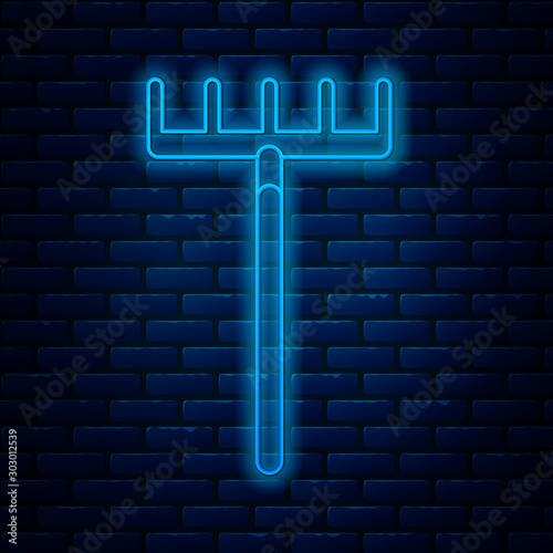Glowing neon line Garden rake icon isolated on brick wall background. Tool for horticulture, agriculture, farming. Ground cultivator. Housekeeping equipment. Vector Illustration