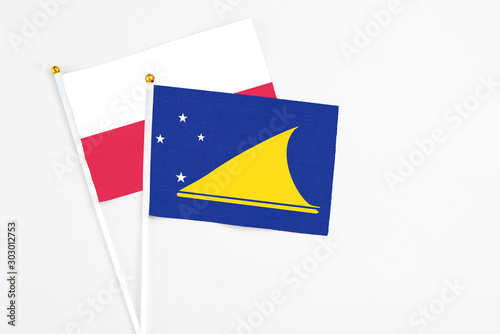 Free Download Tokelau and Poland stick flags on white background. High quality fabric, miniature national flag. Peaceful global concept.White floor for copy space. - GFXLoad
