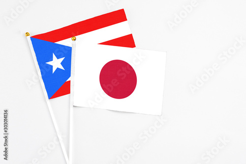 Japan and Puerto Rico stick flags on white background. High quality fabric, miniature national flag. Peaceful global concept.White floor for copy space. Free Download Japan and Puerto Rico stick flags on white background. High quality fabric, miniature national flag. Peaceful global concept.White floor for copy space. - GFXLoad