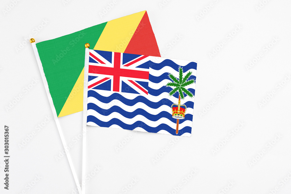 British Indian Ocean Territory and Republic Of The Congo stick flags on white background. High quality fabric, miniature national flag. Peaceful global concept.White floor for copy space.