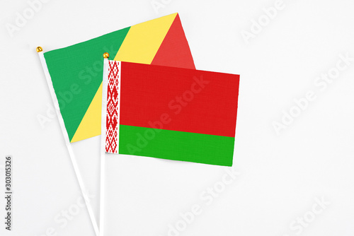 Belarus and Republic Of The Congo stick flags on white background. High quality fabric, miniature national flag. Peaceful global concept.White floor for copy space. photo