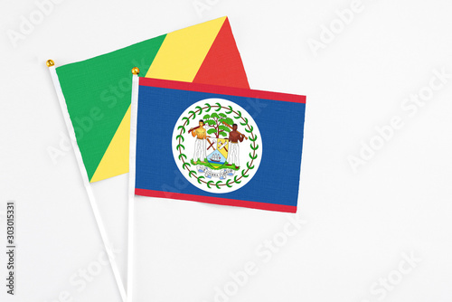 Free Download Belize and Republic Of The Congo stick flags on white background. High quality fabric, miniature national flag. Peaceful global concept.White floor for copy space. - GFXLoad