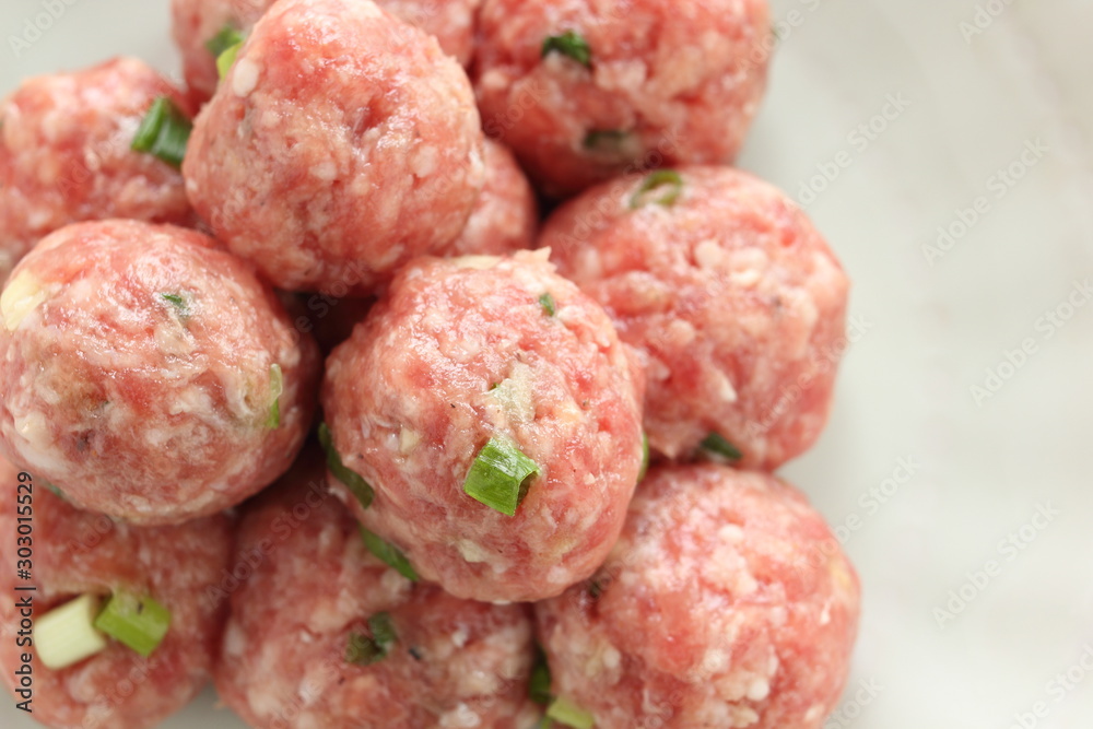 Homemade Chinese pork mea ball on dish for hot pot cooking image Homemade Chinese pork mea ball on dish for hot pot cooking image