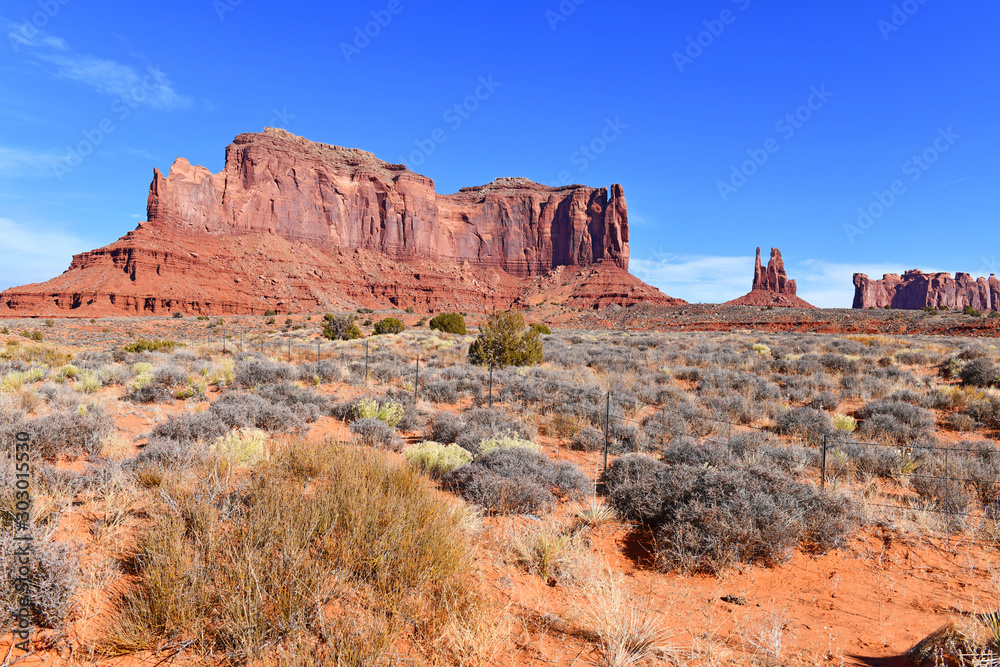 The Red rock desert landscape of Monument Valley, Navajo Tribal Park in the southwest USA in Arizona and Utah, America The Red rock desert landscape of Monument Valley, Navajo Tribal Park in the southwest USA in Arizona and Utah, America