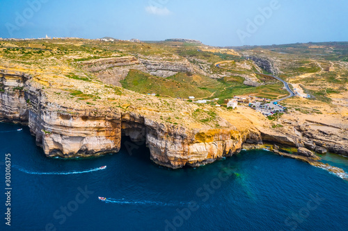 Aerial view of Sea Tunnel near Azure window. Dwejra is a lagoon of seawater on the Gozo island. Boats, blue sea. Mediterranean sea. Malta  photo