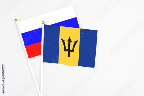 Free Download Barbados and Russia stick flags on white background. High quality fabric, miniature national flag. Peaceful global concept.White floor for copy space. - GFXLoad