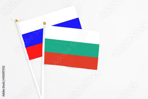 Free Download Bulgaria and Russia stick flags on white background. High quality fabric, miniature national flag. Peaceful global concept.White floor for copy space. - GFXLoad