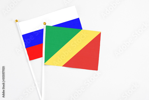 Free Download Republic Of The Congo and Russia stick flags on white background. High quality fabric, miniature national flag. Peaceful global concept.White floor for copy space. - GFXLoad