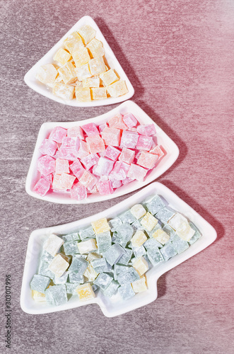 Traditional Dessert Turkish Delight in a plate in the shape of a Christmas tree. photo