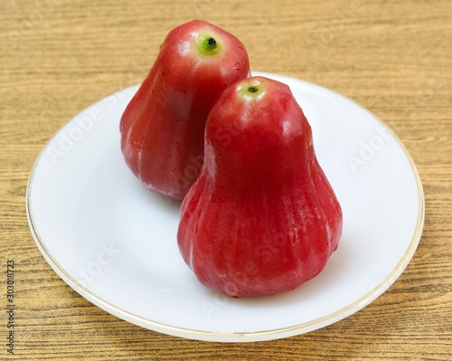 Two Red Water Apples on White Plate photo