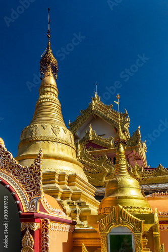 Stupas of Dhammikarama Burmese Temple in Georgetown of Penang in Malaysia. Vertical view.