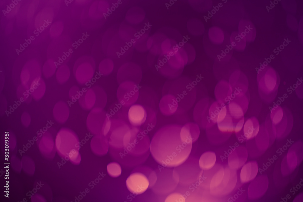 Dark Purple Festive Christmas Beautiful abstract Background with bokeh lights. Holiday Texture with copy space. Can be used as Wallpaper, filling for a website, defocused