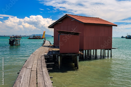 Small fishing house on a wooden bridge in Tan Jetty, part of the Clan Jetties, Georgetown, Penang, Malaysia.